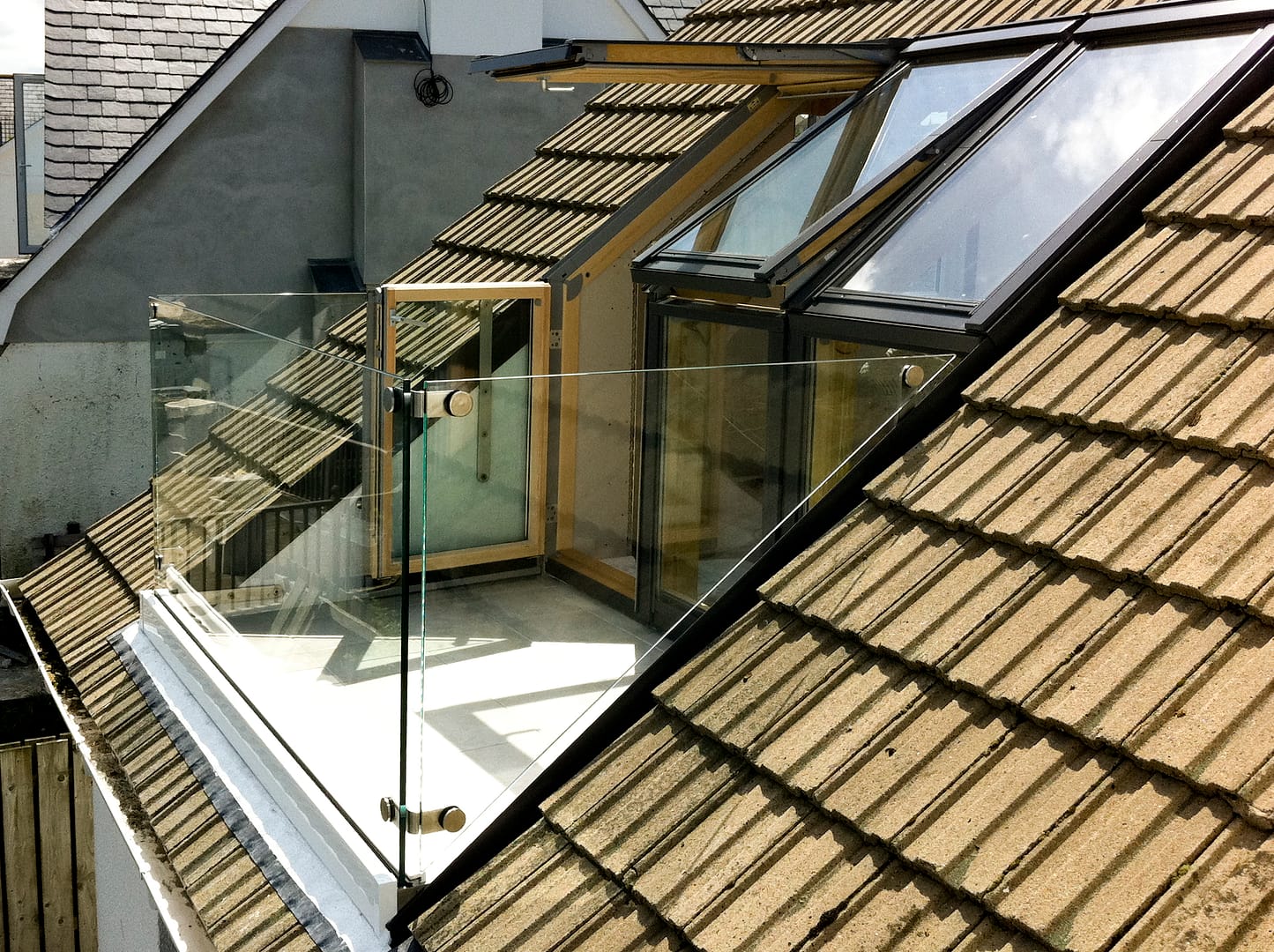 Create a safe outdoor living space at your home in Cornwall with a beautiful semi-framed balustrade.