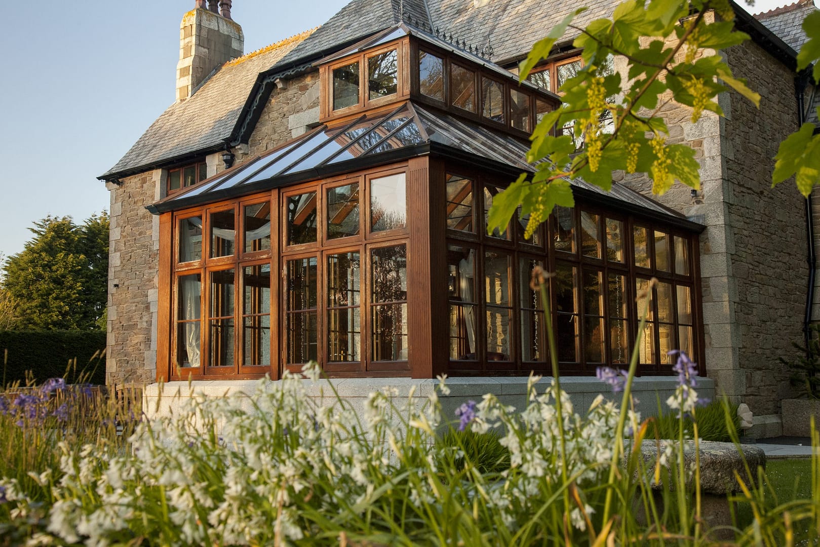 A lantern-roof conservatory in Cornwall by Philip Whear provides security, style and immerses itself in beautiful surroundings.
