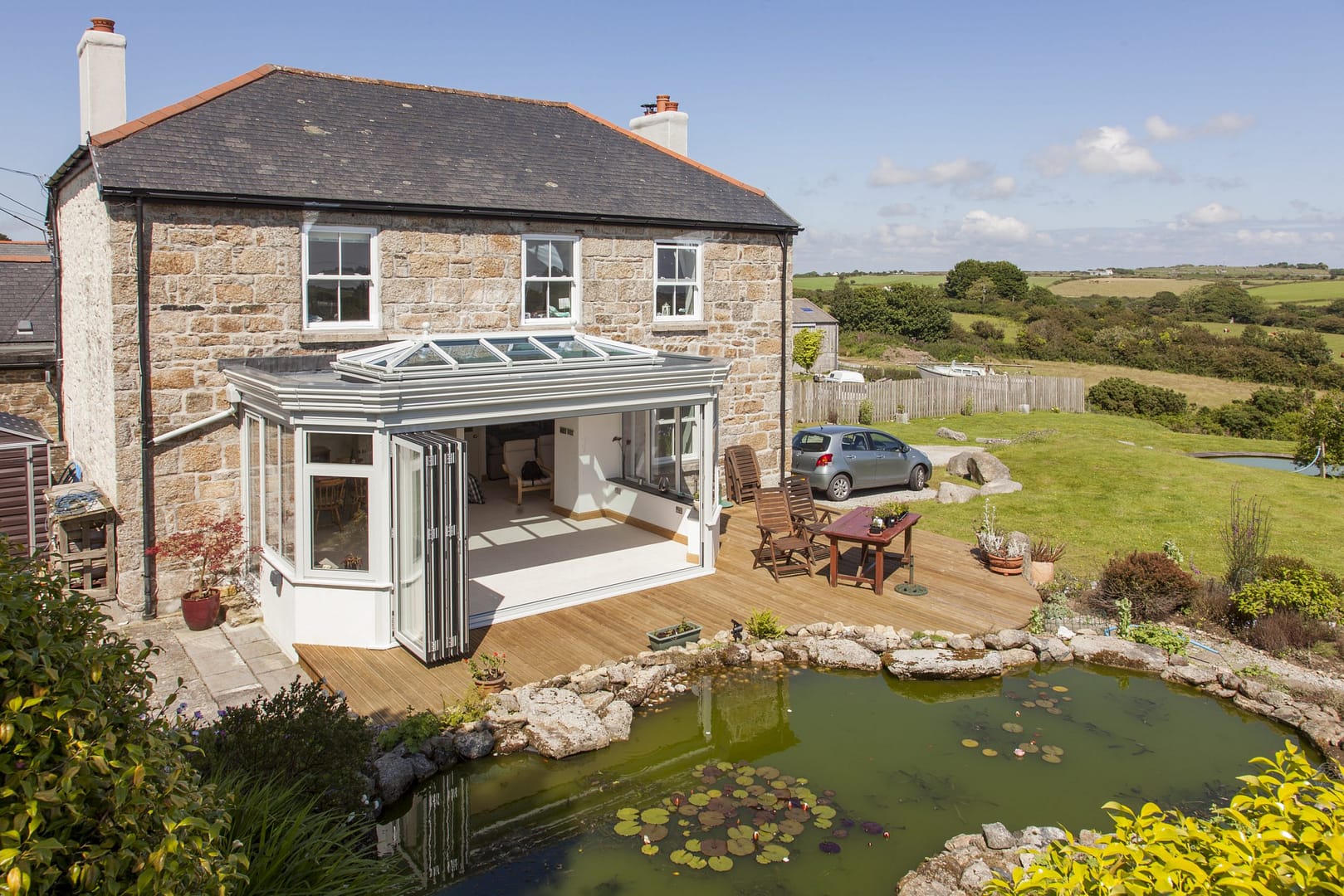 A bi-fold door in Cornwall by Philip Whear provides style and security