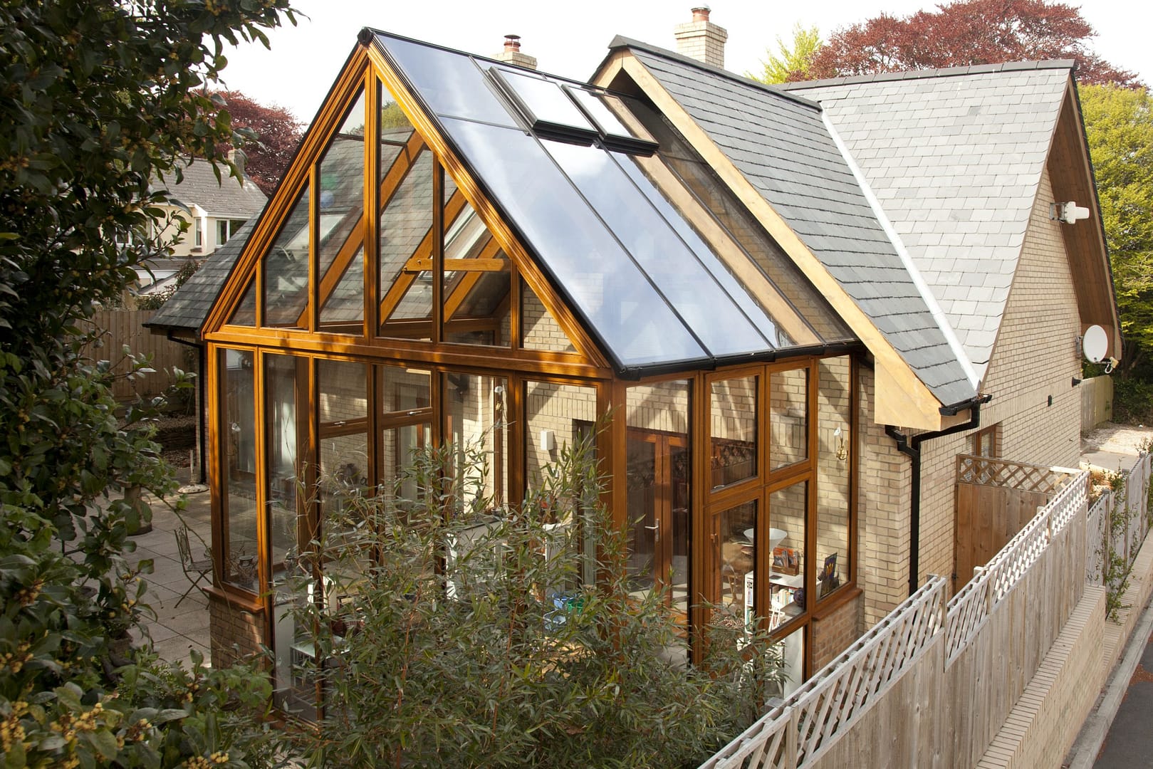 A timber conservatory in Cornwall by Philip Whear provides security, style and complements its beautiful rural surroundings.