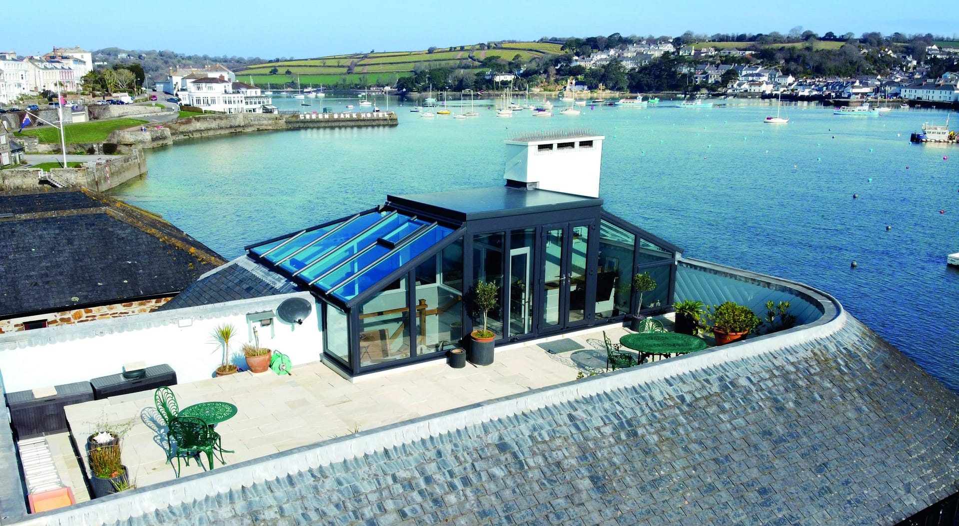 A hipped-roof conservatory in Cornwall by Philip Whear provides security, style and immerses itself in beautiful surroundings.